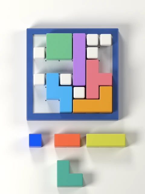 Nookroll board with a flat light-grey floor with 25 intersection dots and four colourful puzzle pieces.